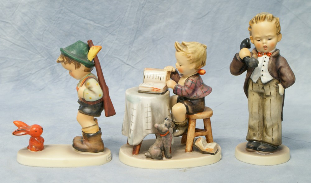 Appraisal: Goebel Hummel Figurines Little Bookkeeper some crazing No TMK- Sensitive