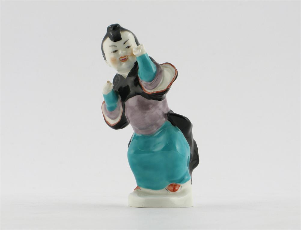 Appraisal: A Royal Worcester bone china figure of a young Chinese