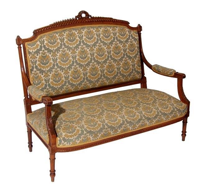 Appraisal: A FRENCH BEECH WOOD SETTEE with carved foliate swag surmount