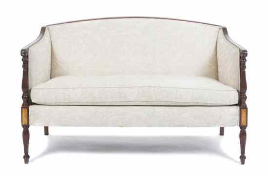 Appraisal: A Sheraton Style Settee having an upholstered back arms and