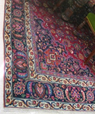 Appraisal: PERSIAN MASHAD CARPET hand knotted in a floral and floral