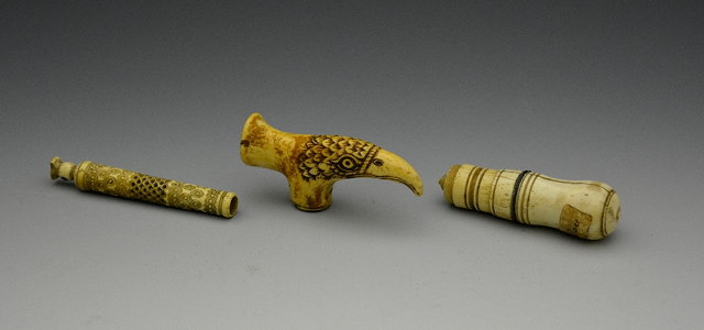 Appraisal: A European carved ivory needlecase a bone stick handle in