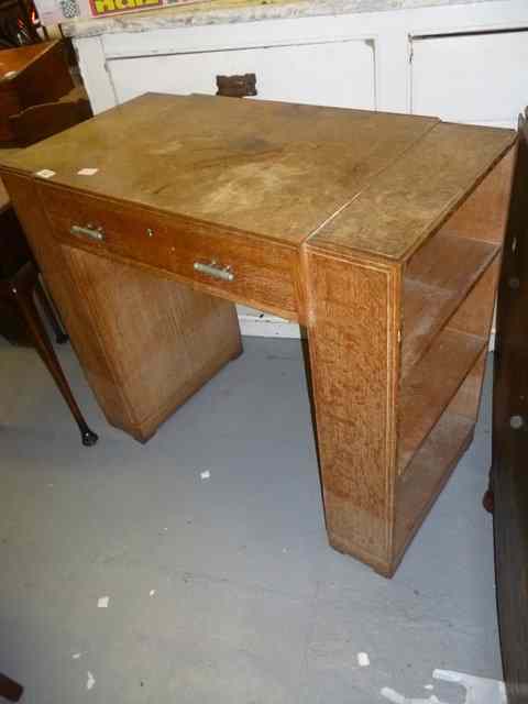 Appraisal: A SMALL LIMED OAK DESK BY HEALS with single drawer