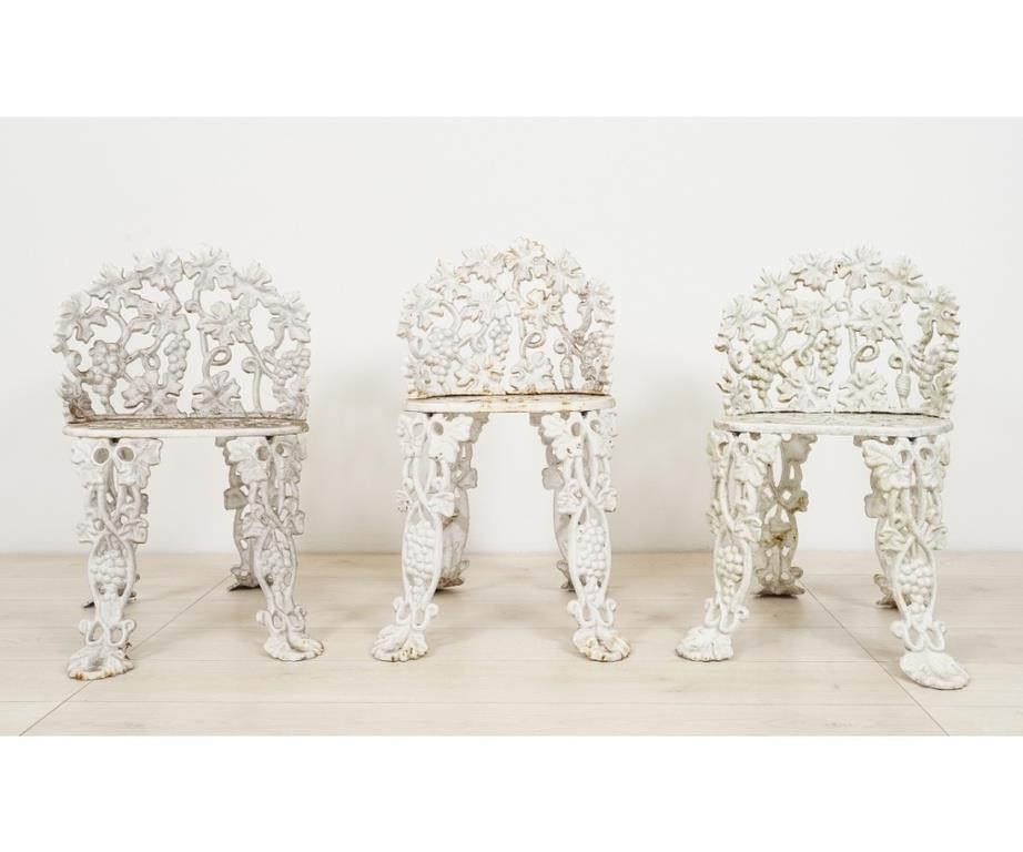 Appraisal: Three small cast iron grape vine pattern chairs Approx h