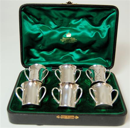 Appraisal: A cased set of six Irish three handled tot cups