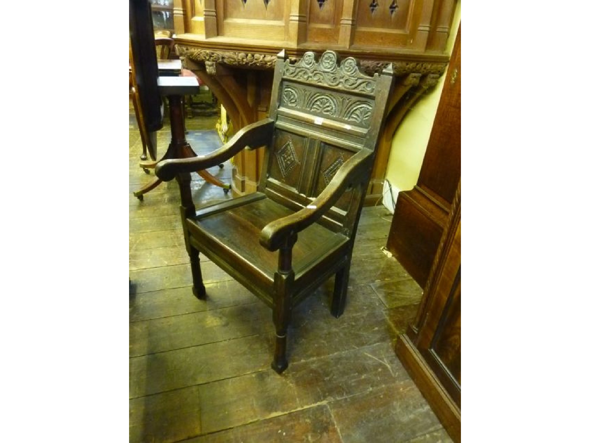 Appraisal: An Old English oak wainscot chair with panelled back with