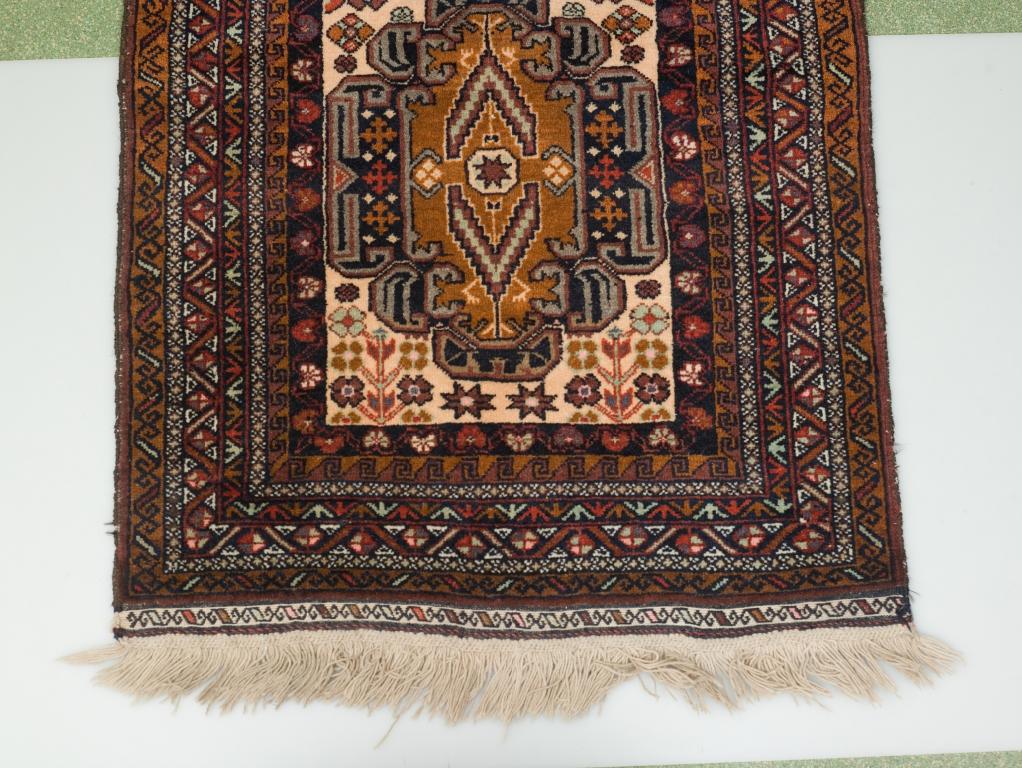 Appraisal: AFGHAN BELOUCH with light fawn central field m by m