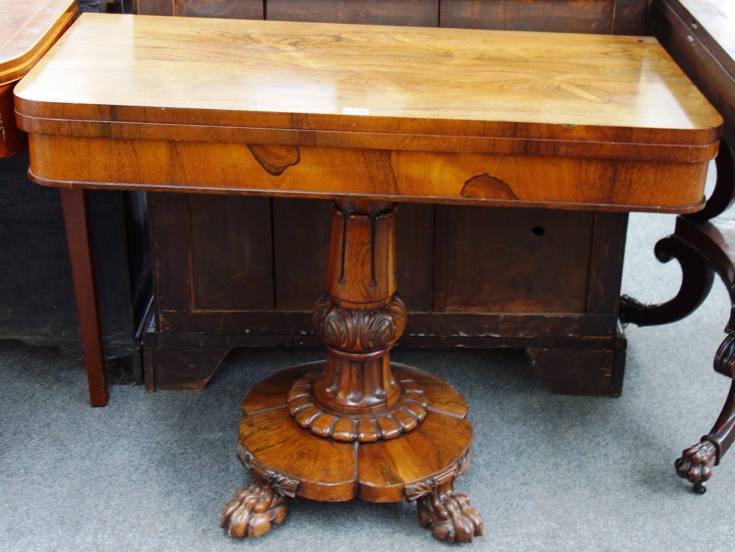 Appraisal: A William IV rosewood card table on tulip carved column