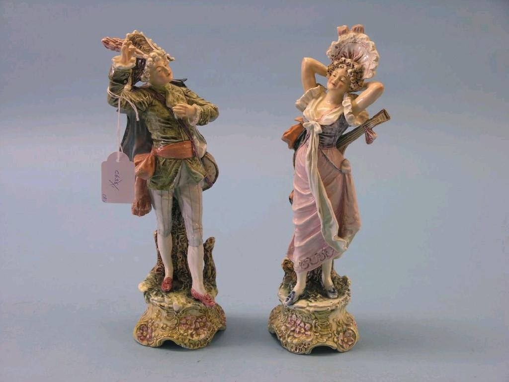 Appraisal: A pair of German earthenware figures gallant and female companion