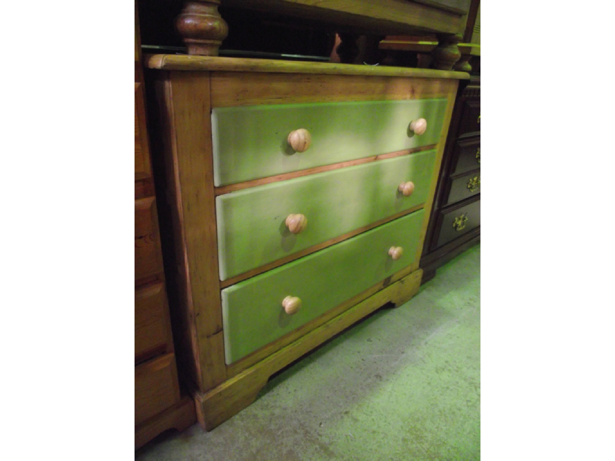 Appraisal: A partially stripped and waxed pine chest of three long