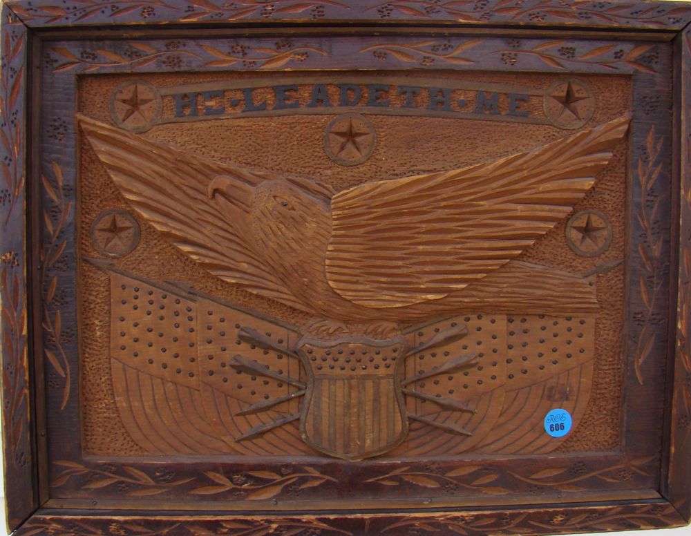 Appraisal: CARVED WOOD PANEL Depicting an eagle with talons clenched around