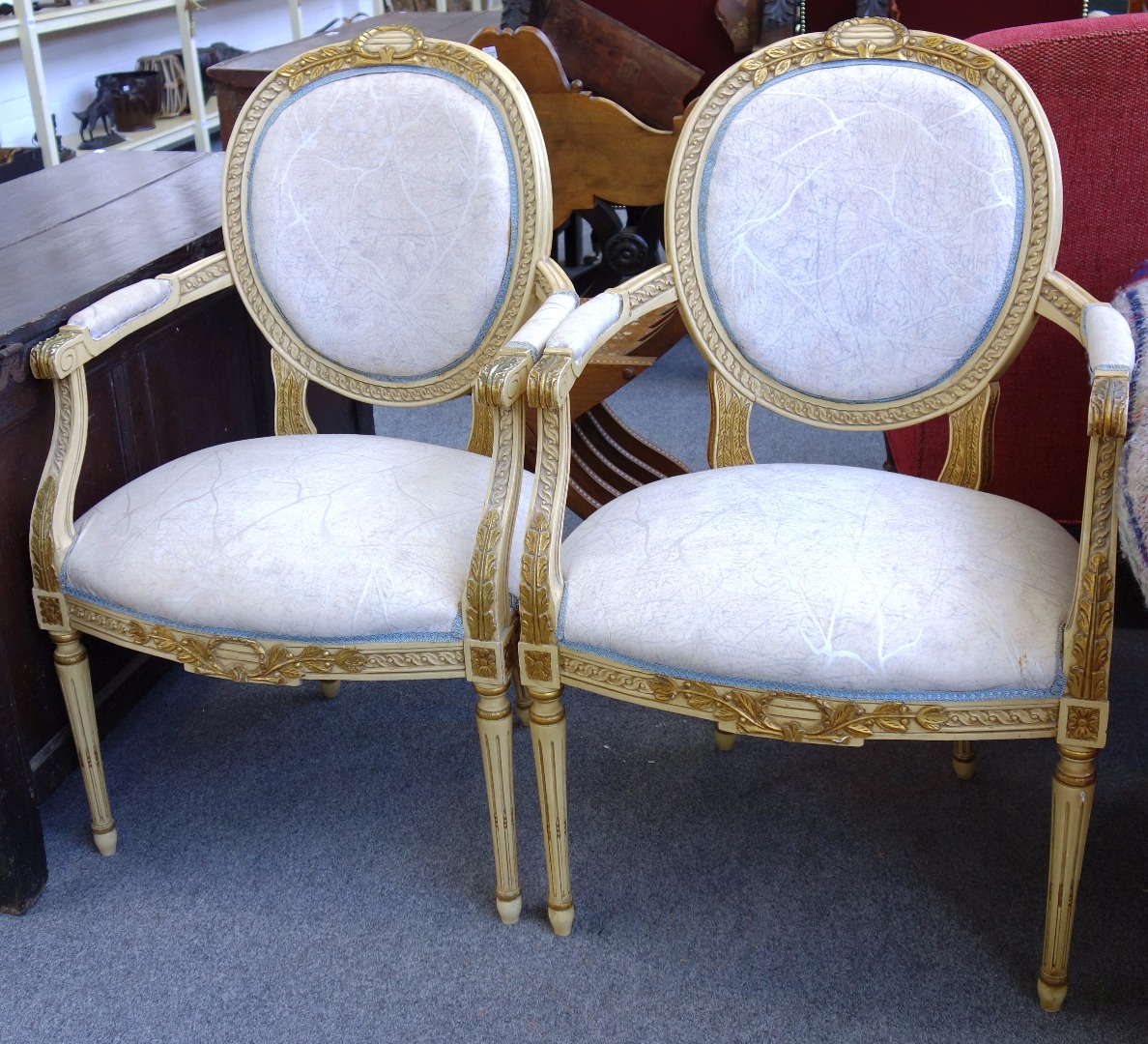 Appraisal: A pair of Louis XVI style painted fauteuils with bow