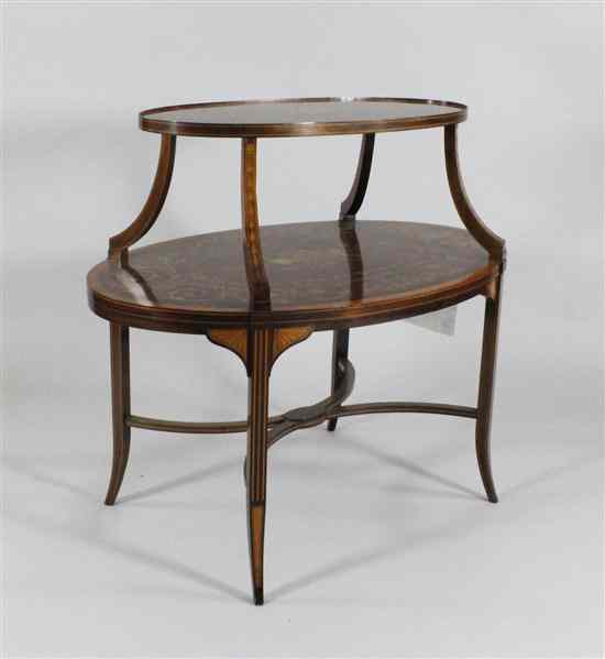 Appraisal: An Edwardian inlaid mahogany two tier table on splayed square