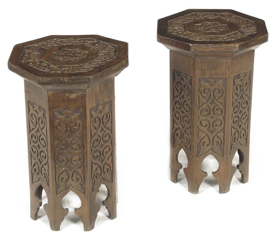 Appraisal: A pair of carved and stained wood octagonal stands