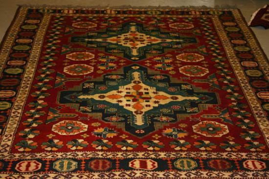 Appraisal: Kazak Rug Chechen rug containing a vibrant red field occupied