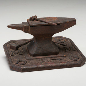 Appraisal: A Folk Art Carved and Stained Wood Anvil and Hammer