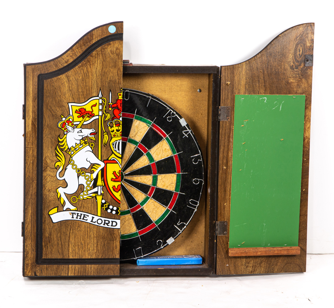 Appraisal: A DART BOARD IN CASE A dart board in case