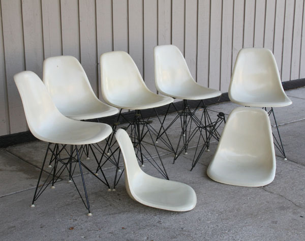 Appraisal: Charles Eames set of white shell chairs on eiffel tower