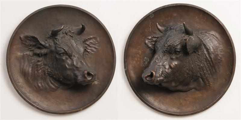 Appraisal: PAIR OF ROUND PLAQUES WITH COWS' HEADS AFTER J PRIESTMAN