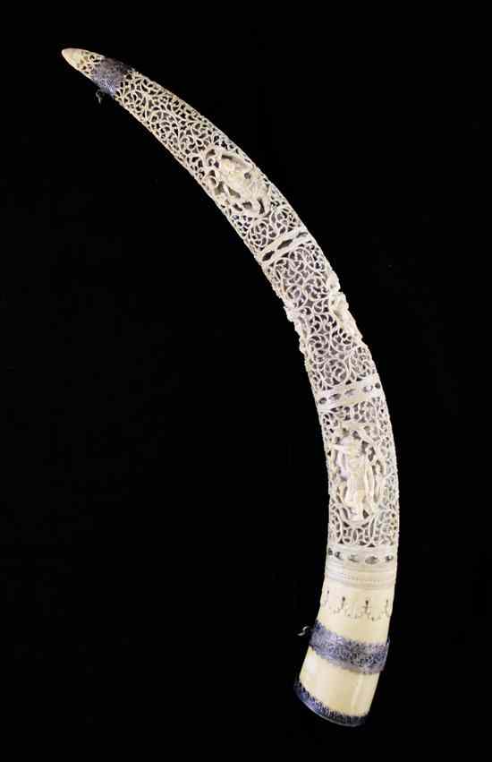 Appraisal: A Burmese ivory and silver mounted tusk carving th century