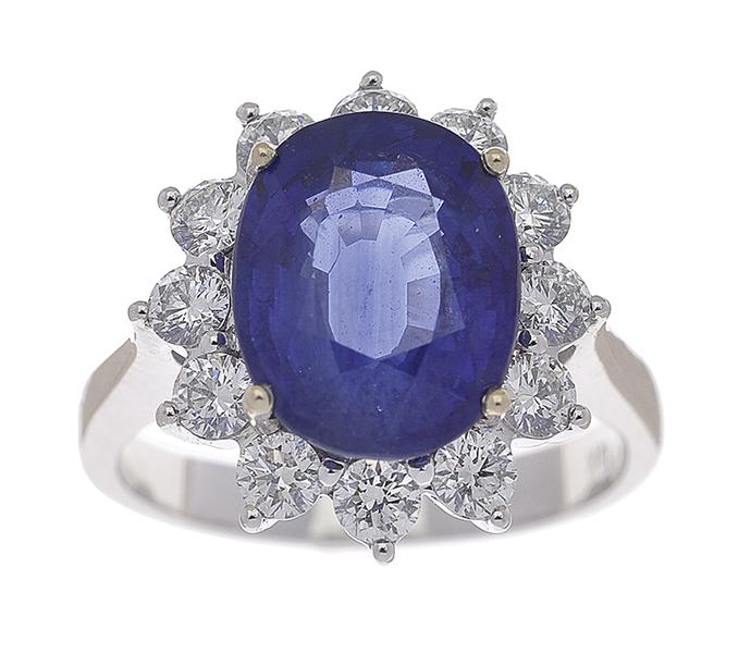 Appraisal: A SAPPHIRE AND DIAMOND RING Of cluster design featuring an