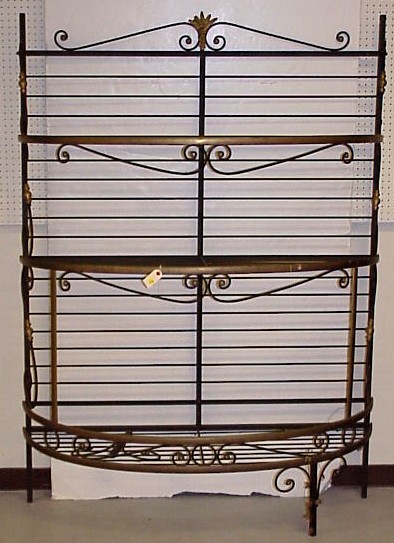 Appraisal: Brass and iron bakers' rack Scrolled iron and wheat decoration