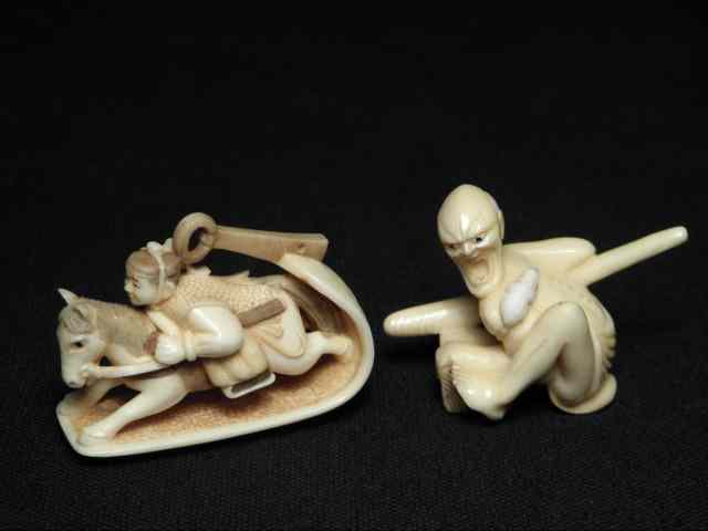 Appraisal: Two Japanese carved ivory netsuke Includes a display depicting a