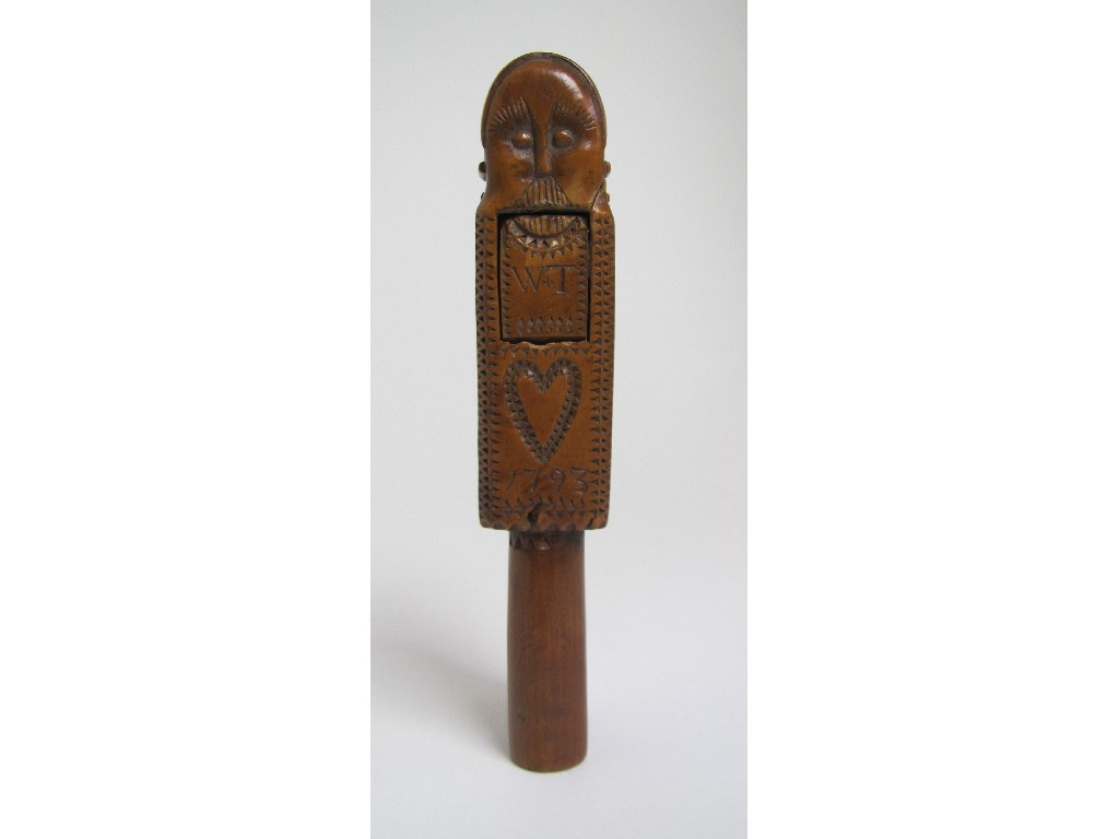 Appraisal: An th Century fruitwood nutcracker carved with a mask head