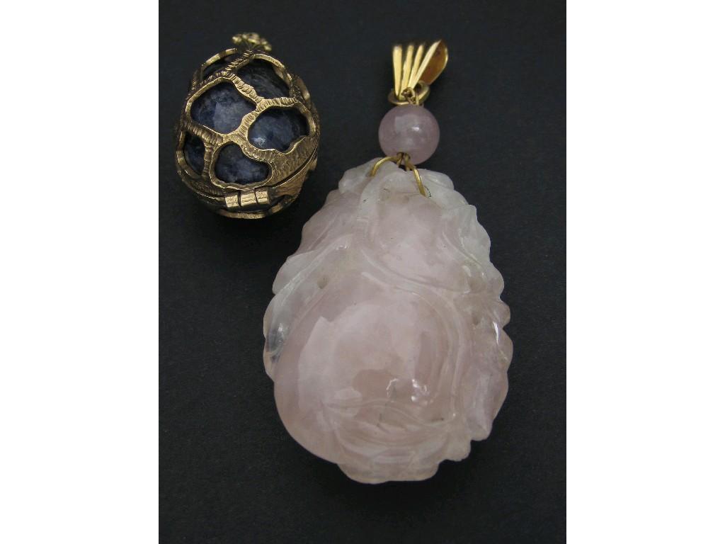 Appraisal: A carved Rose Quartz Pendant with yellow metal mount and