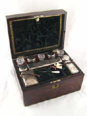 Appraisal: A mahogany dressing case with lock and key fully fitted