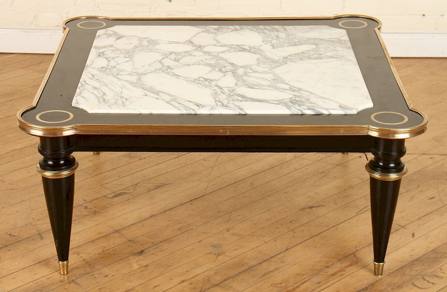 Appraisal: JANSEN EBONIZED WOOD MARBLE TOP COFFEE TABLE A Jansen French