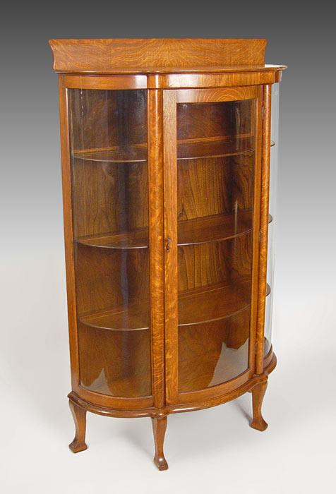 Appraisal: TRIPLE BOW FRONT OAK CHINA CABINET Late Victorian quarter sawn