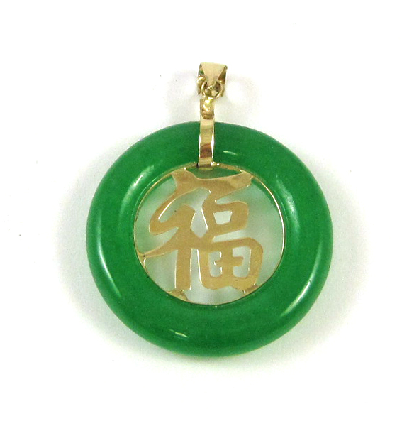 Appraisal: JADE AND FOURTEEN KARAT GOLD PENDANT with a round green