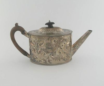 Appraisal: A George III navette shaped tea pot later embossed decoration