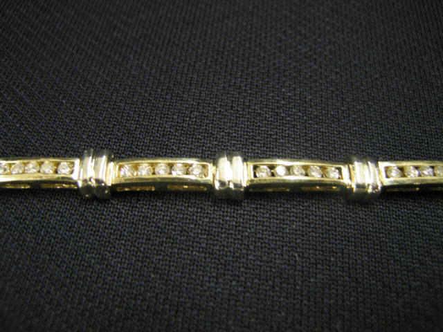 Appraisal: Diamond Bracelet two-tone style with channel set diamonds totaling carats