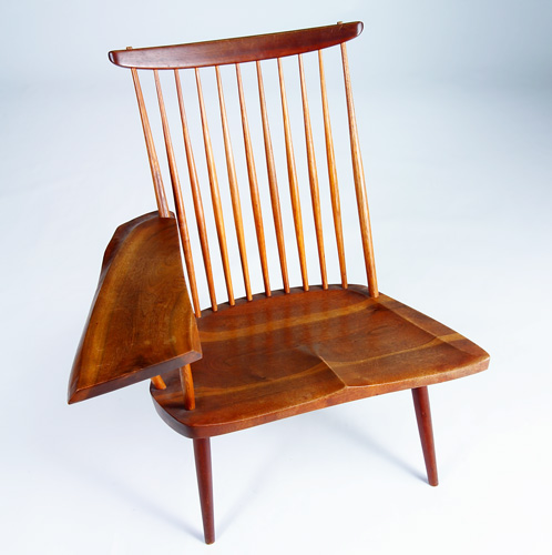 Appraisal: GEORGE NAKASHIMA Walnut lounge chair with single free-edge writing arm