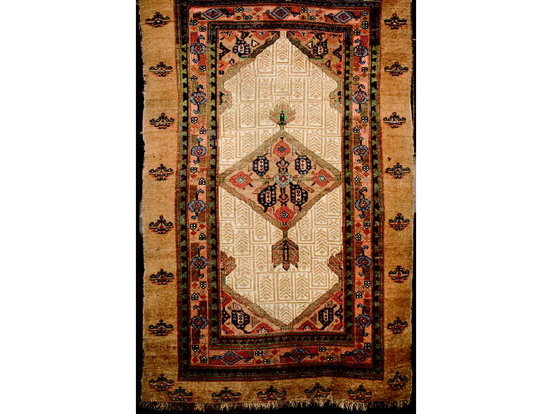 Appraisal: PERSIAN CAMEL HAIR HAMADAN THROW RUG The ivory field of