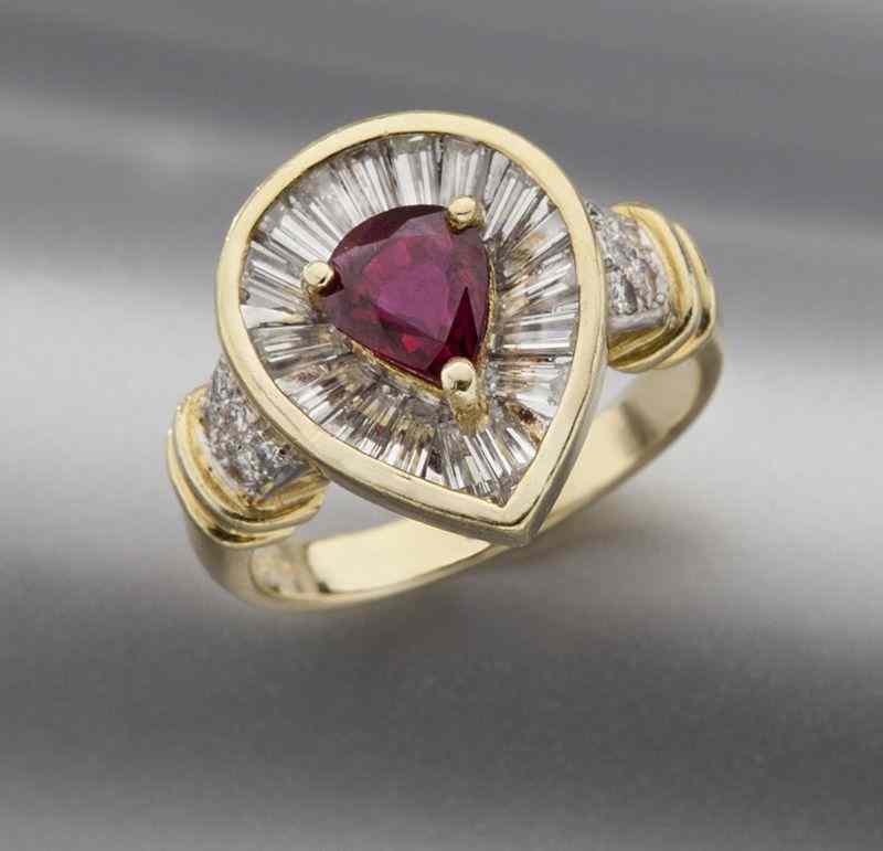 Appraisal: K gold diamond and ruby ringfeaturing a pear shaped ruby