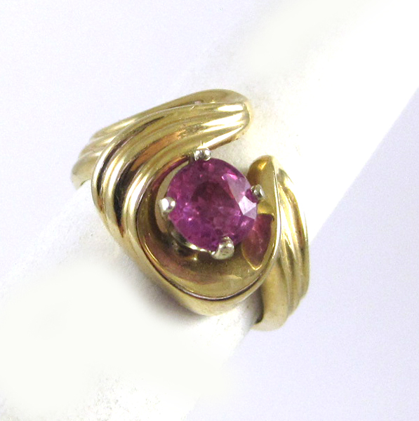 Appraisal: PINK TOPAZ AND FOURTEEN KARAT GOLD RING set with a