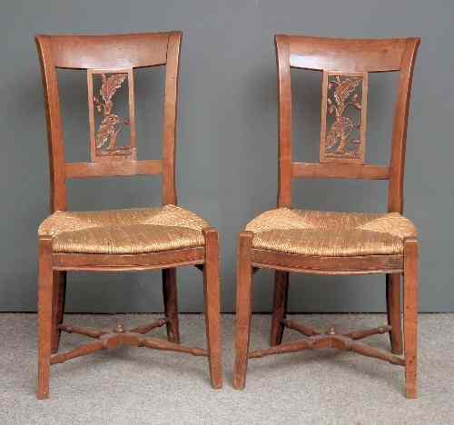 Appraisal: A pair of early th Century Continental fruitwood chairs with