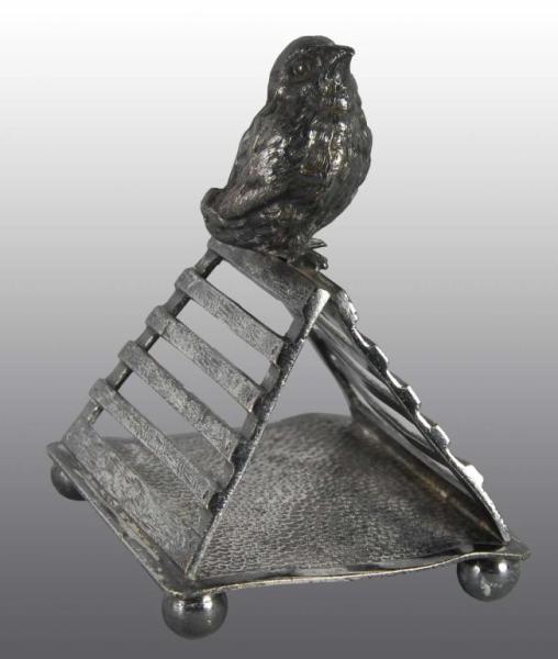 Appraisal: Chick on Crate Figural Napkin Ring Description Tufts Silver plate