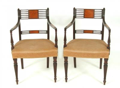 Appraisal: A SET OF FOUR REGENCY MAHOGANY ELBOW CHAIRS the reeded