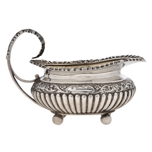 Appraisal: A Victorian silver cream jug with acanthus handle and gadrooned