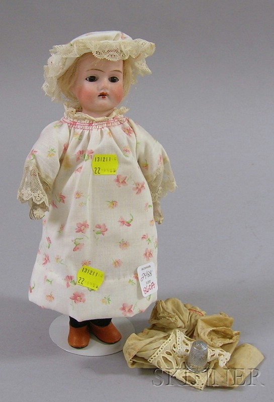 Appraisal: Small German Bisque Shoulder Head Doll with cloth body and