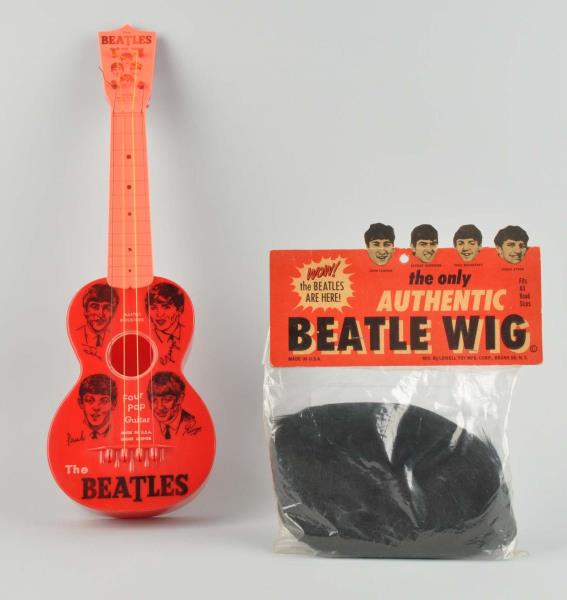 Appraisal: Beatles Toy Guitar And Wig This lot includes a Beatles