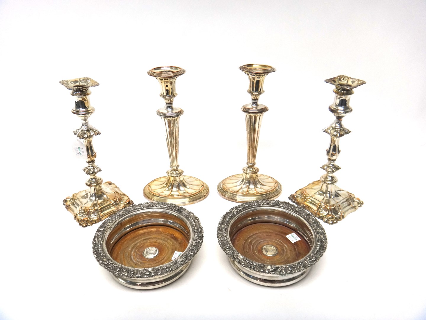 Appraisal: A pair of plated on copper table candlesticks each on