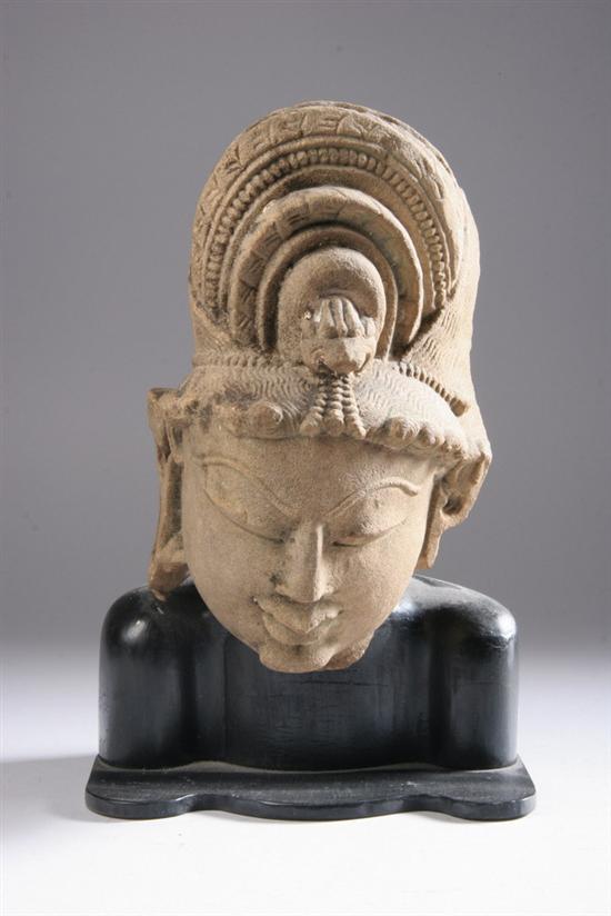 Appraisal: INDIAN SANDSTONE HEAD OF DEITY Circa th century Carved with