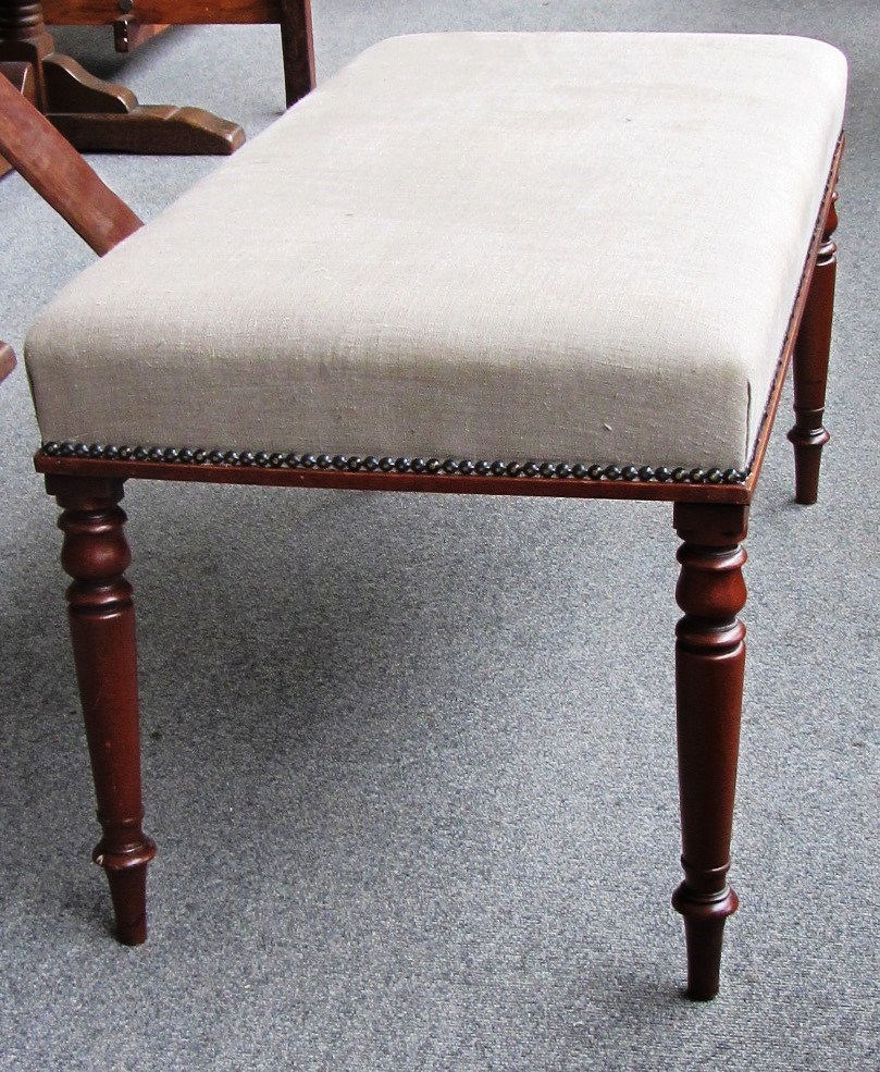 Appraisal: A large rectangular foot stool the studded overstuffed top on