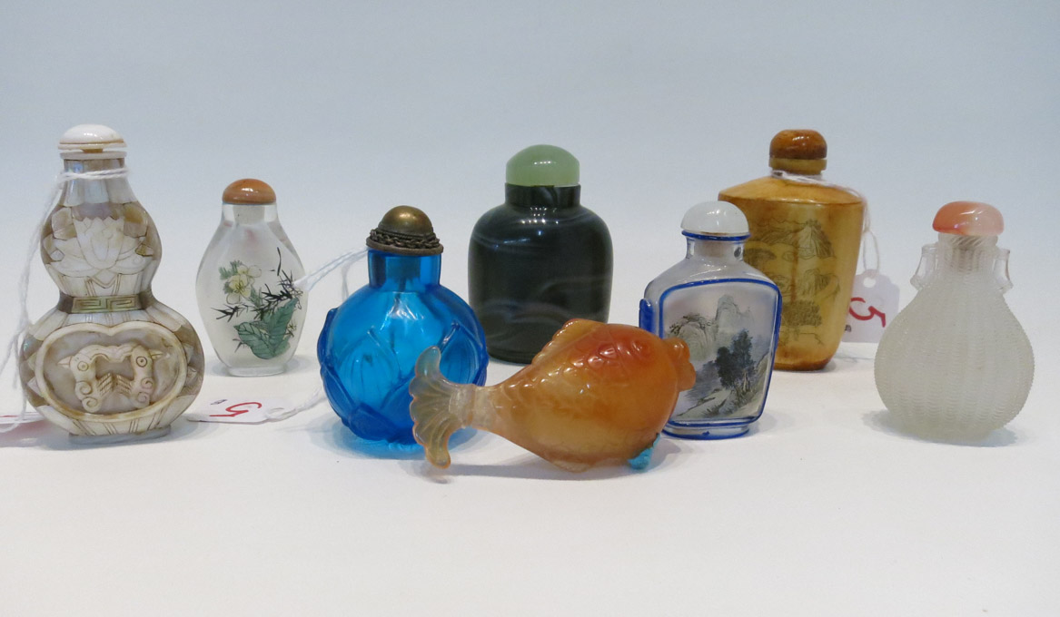 Appraisal: EIGHT CHINESE SNUFF BOTTLES circular blue glass bottle with relief