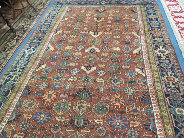 Appraisal: Heriz Persian Handmade Room Size Rug semi-antique geometric designs salmon